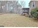 Backyard with expansive lawn and a screened in porch at 40 High St, Sharpsburg, GA 30277