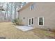 Exterior backyard featuring concrete patio, lawn, and home exterior with multiple windows and French doors at 40 High St, Sharpsburg, GA 30277