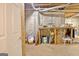 Unfinished basement featuring concrete walls and ceiling with exposed ductwork, offering potential for customization at 40 High St, Sharpsburg, GA 30277