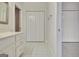 Bathroom featuring a vanity with a marble countertop and large closets at 40 High St, Sharpsburg, GA 30277