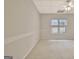 Bright bedroom featuring neutral carpet, a window, and a ceiling fan at 40 High St, Sharpsburg, GA 30277