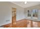 Empty bedroom with hardwood floors, natural light, and view of the outdoor deck space at 40 High St, Sharpsburg, GA 30277