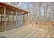 Outdoor deck featuring screened porch and fenced yard at 40 High St, Sharpsburg, GA 30277