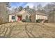 Stylish home with attractive landscaping and a mix of stone and stucco exterior at 40 High St, Sharpsburg, GA 30277