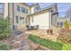 Spacious stone patio includes outdoor seating and a fire pit overlooking the yard at 120 Middleton Dr, Peachtree City, GA 30269