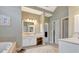 Bright bathroom features double vanity, a soaking tub, and neutral tones at 120 Middleton Dr, Peachtree City, GA 30269
