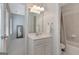 Bright bathroom featuring a vanity with sink, mirror, lighting fixture and shower/tub combo at 120 Middleton Dr, Peachtree City, GA 30269