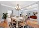 Well-lit dining room with hardwood floors and neutral color palette at 120 Middleton Dr, Peachtree City, GA 30269