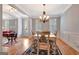 Well-lit dining room with hardwood floors and neutral color palette at 120 Middleton Dr, Peachtree City, GA 30269