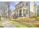 Charming home with a welcoming porch, an American flag, and professionally landscaped yard at 120 Middleton Dr, Peachtree City, GA 30269