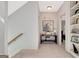 Upstairs hallway showcases unique art and access to bedrooms and built-in shelving at 120 Middleton Dr, Peachtree City, GA 30269