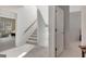 Hallway with carpeted stairs leading to a second floor and views to bedrooms at 120 Middleton Dr, Peachtree City, GA 30269