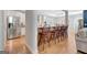 Modern kitchen with stainless steel appliances, granite countertops, and bar seating to living room at 120 Middleton Dr, Peachtree City, GA 30269