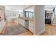 Open kitchen with island bar, stainless steel dishwasher and sink, granite countertops, and wooden floors at 120 Middleton Dr, Peachtree City, GA 30269