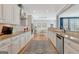 Modern kitchen with white cabinetry, granite countertops, and stainless steel appliances with eat in area at 120 Middleton Dr, Peachtree City, GA 30269