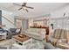 Bright living room featuring hardwood floors, neutral tones, and an open layout to the kitchen at 120 Middleton Dr, Peachtree City, GA 30269
