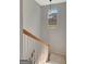 Bright staircase with white railing and a view through the window at 120 Middleton Dr, Peachtree City, GA 30269