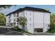 Condo building with lower level garages, second-story balconies, and well-kept landscaping at 1000 Blair Ln # 302, Peachtree City, GA 30269