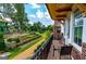 Relax on this balcony overlooking the landscaped gardens in this inviting residential neighborhood at 135 Kelmscott Ln, Fayetteville, GA 30214