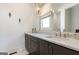 This well-lit bathroom features a double vanity with marble countertop at 135 Kelmscott Ln, Fayetteville, GA 30214