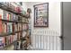 Cozy Bedroom with a white crib and floor-to-ceiling bookshelves at 135 Kelmscott Ln, Fayetteville, GA 30214