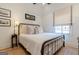 Bright bedroom with stained glass window and hardwood floors at 135 Kelmscott Ln, Fayetteville, GA 30214