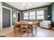 Bright dining room with modern chandelier, round table, and ample natural light at 135 Kelmscott Ln, Fayetteville, GA 30214