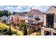 A high-angle view displays the beautiful architecture and landscaping of the homes at 135 Kelmscott Ln, Fayetteville, GA 30214