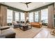 Bright living room with big windows, modern furniture, neutral colors, and stylish decor at 135 Kelmscott Ln, Fayetteville, GA 30214