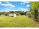 Vast backyard features a storage shed and a tall wooden privacy fence at 229 Callaway Rd, Fayetteville, GA 30215