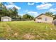 Wide open backyard with an additional detached garage and an aging privacy fence at 229 Callaway Rd, Fayetteville, GA 30215
