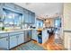 Well-lit kitchen featuring stainless steel appliances and a view into the dining area at 229 Callaway Rd, Fayetteville, GA 30215