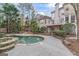 Large backyard with a pool, spa, patio and a wooden pergola at 612 Champions Dr, Mcdonough, GA 30253