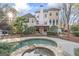 View of the large backyard and pool, surrounded by lush landscaping at 612 Champions Dr, Mcdonough, GA 30253