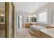 Elegant bathroom featuring a jacuzzi tub and dual sinks at 612 Champions Dr, Mcdonough, GA 30253