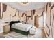 Stylish bedroom with unique wall design, hardwood floors, and plenty of natural light at 612 Champions Dr, Mcdonough, GA 30253