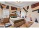 Inviting bedroom with a stylish abstract wall design and hardwood floors at 612 Champions Dr, Mcdonough, GA 30253