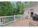 Inviting deck overlooking a private backyard pool and lush landscaping at 612 Champions Dr, Mcdonough, GA 30253