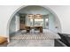 Open-concept dining room featuring stylish lighting fixtures, dining table, and custom built-in bar storage at 612 Champions Dr, Mcdonough, GA 30253