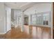 Spacious foyer boasts hardwood floors, classic trim, modern lighting, and staircase at 612 Champions Dr, Mcdonough, GA 30253