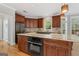 Large kitchen island features granite countertops and built-in appliances at 612 Champions Dr, Mcdonough, GA 30253