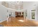 Expansive living room featuring hardwood floors, fireplace, and open access to the kitchen at 612 Champions Dr, Mcdonough, GA 30253