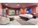 The spacious main bedroom features a cozy sitting area with plush chairs, complemented by natural light and stylish decor at 612 Champions Dr, Mcdonough, GA 30253