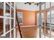 Bright home office with hardwood floors, natural light, and a unique library ladder for elevated storage at 612 Champions Dr, Mcdonough, GA 30253