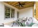 Relaxing covered back porch with ceiling fan and outdoor seating area at 3785 Pilgrim Mill Rd, Cumming, GA 30041