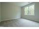 Neutral carpeted bedroom is bright with natural light at 3785 Pilgrim Mill Rd, Cumming, GA 30041