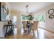 Dining room features a table with seating, a chandelier, and exterior views at 3785 Pilgrim Mill Rd, Cumming, GA 30041