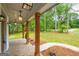 Covered front porch with brick flooring, wood columns, and stylish hanging lanterns at 3785 Pilgrim Mill Rd, Cumming, GA 30041