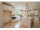 The kitchen is well-appointed with stainless steel appliances, shaker cabinets, a breakfast bar, and gray subway tile backsplash at 3785 Pilgrim Mill Rd, Cumming, GA 30041