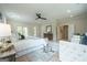 Bright and spacious main bedroom features light hardwood flooring, ceiling fan, and ensuite bathroom at 3785 Pilgrim Mill Rd, Cumming, GA 30041